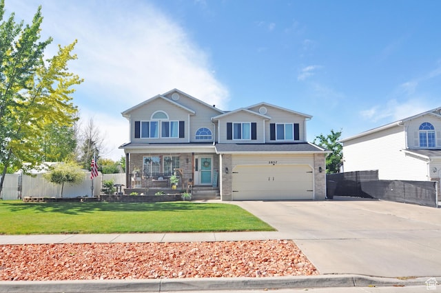 2857 W 2250 N, Clinton, UT 84015 - view of front facade with concrete driveway, a garage, and a porch