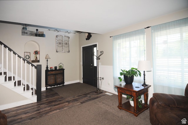 2857 W 2250 N, Clinton, UT 84015 - entrance foyer with stairs, dark wood-style floors, and dark carpet