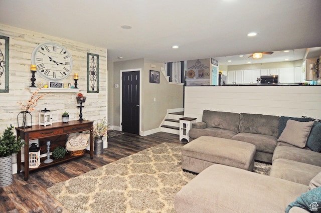 2857 W 2250 N, Clinton, UT 84015 - living area with dark wood-style floors, wooden walls, stairway, recessed lighting, and a ceiling fan