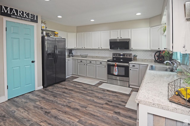 2857 W 2250 N, Clinton, UT 84015 - kitchen featuring stainless steel appliances, light countertops, backsplash, dark wood finished floors, and recessed lighting