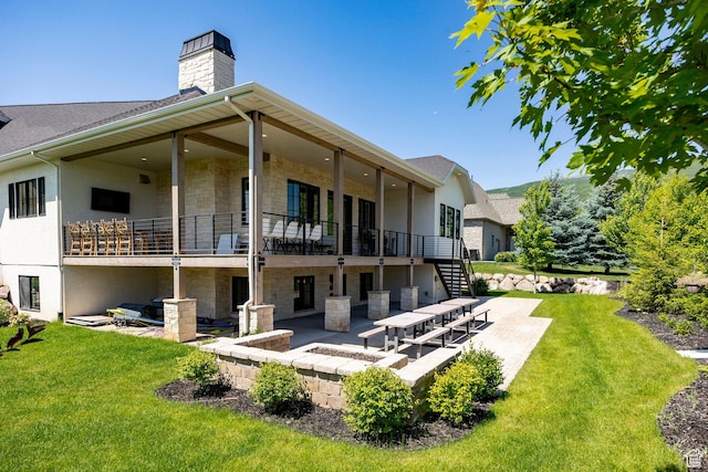 905 S Coldwater Way, Midway, UT 84049 - rear view of property with stone siding, a patio area, a fire pit, a chimney, and a yard