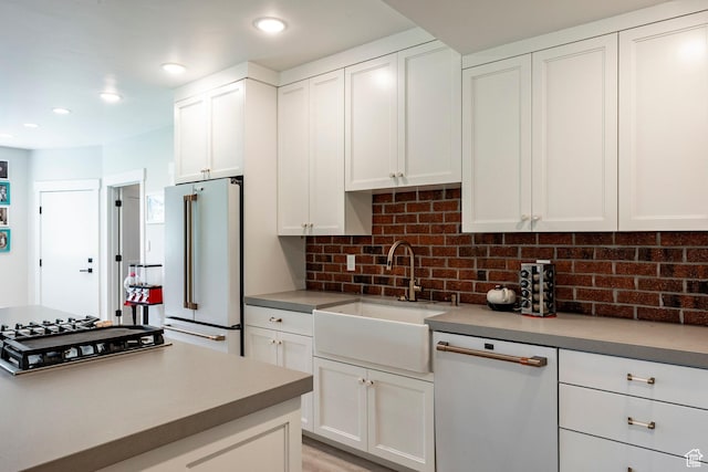 905 S Coldwater Way, Midway, UT 84049 - kitchen featuring white appliances, decorative backsplash, white cabinets, recessed lighting, and light countertops