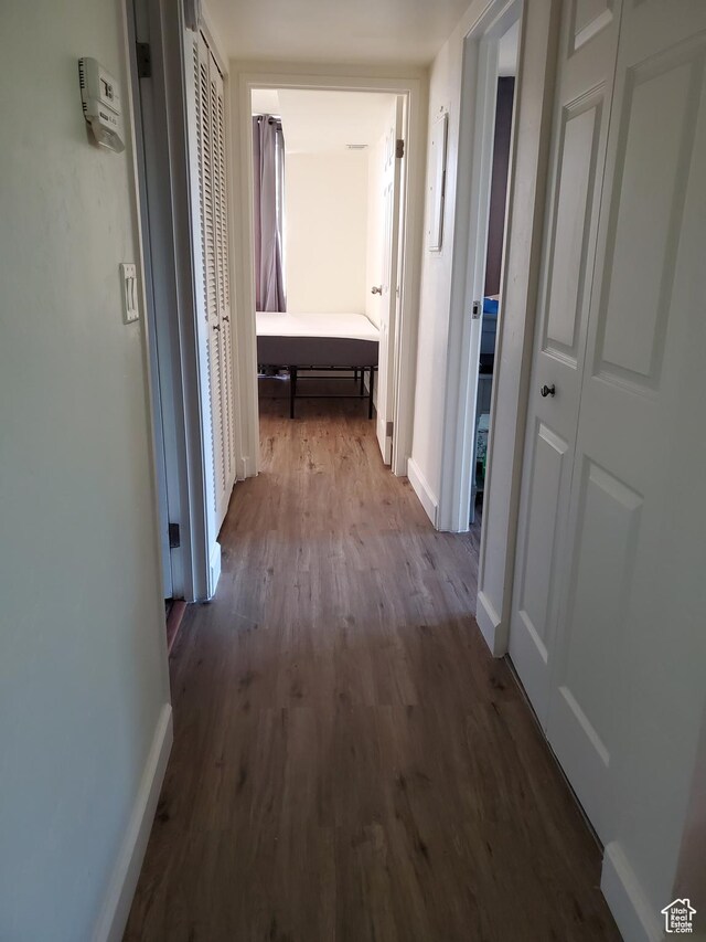 115 S 1100 E, Salt Lake City, UT 84102 - hallway featuring dark wood-style flooring and baseboards