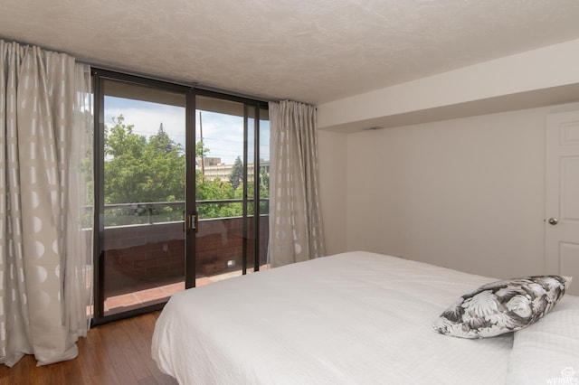 115 S 1100 E, Salt Lake City, UT 84102 - bedroom featuring wood finished floors, access to exterior, and a wall of windows