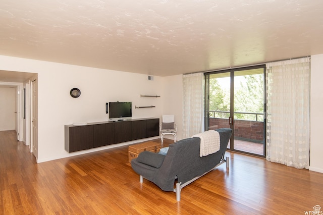 115 S 1100 E, Salt Lake City, UT 84102 - living room with wood finished floors and floor to ceiling windows