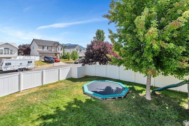 1666 N 160 W, Layton, UT 84041 - fenced backyard featuring a trampoline and a residential view