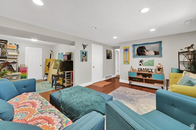604 W 1750 N, Clinton, UT 84015 - living room featuring wood finished floors, recessed lighting, and a textured ceiling