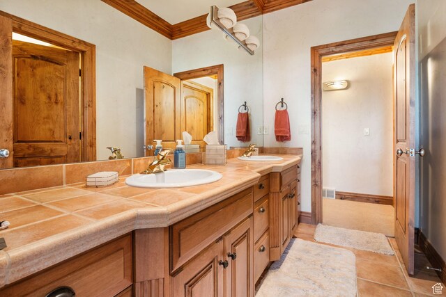10368 S Bedrock Ln E, Sandy, UT 84092 - bathroom featuring double vanity, ornamental molding, and tile patterned flooring