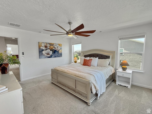 998 W 850 S, Springville, UT 84663 - bedroom with light colored carpet, multiple windows, a textured ceiling, and ceiling fan