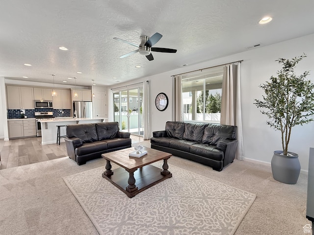 998 W 850 S, Springville, UT 84663 - living room with recessed lighting, light carpet, a textured ceiling, and a ceiling fan