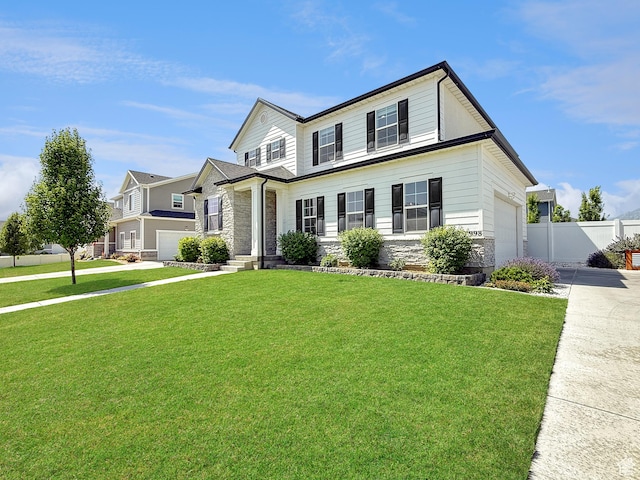 998 W 850 S, Springville, UT 84663 - view of front facade featuring concrete driveway, stone siding, and an attached garage