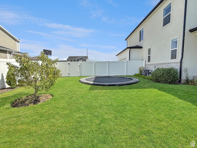 998 W 850 S, Springville, UT 84663 - fenced backyard with a trampoline and a gate