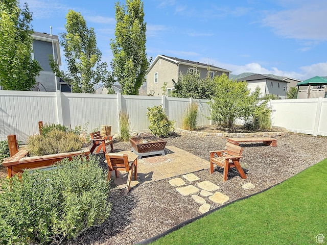998 W 850 S, Springville, UT 84663 - fenced backyard featuring an outdoor fire pit, a patio area, and a residential view