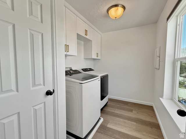 998 W 850 S, Springville, UT 84663 - laundry area featuring washing machine and dryer, cabinet space, and wood finished floors