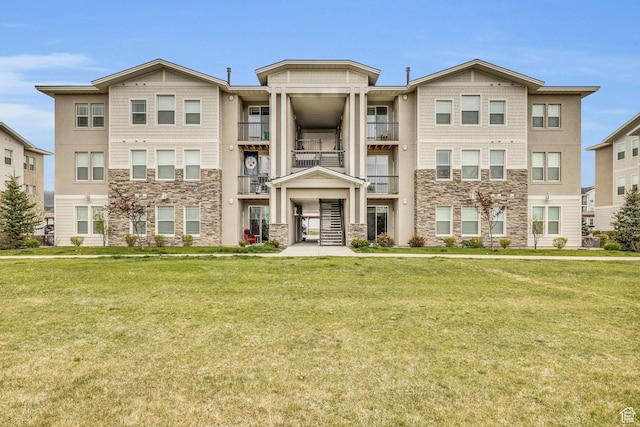 1043 S 500 E Unit G304, Heber City, UT 84032 - view of front of house with stone siding and a front yard
