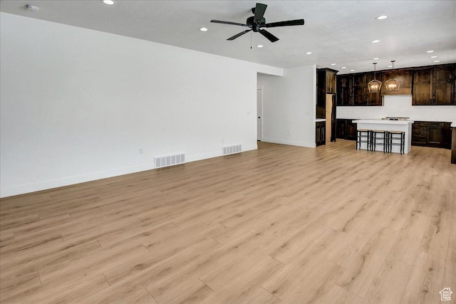1978 N 840 E, North Ogden, UT 84414 - unfurnished living room with recessed lighting, ceiling fan, and light wood-style flooring