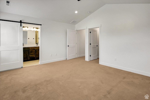 1978 N 840 E, North Ogden, UT 84414 - unfurnished bedroom with light colored carpet, vaulted ceiling, a barn door, ensuite bathroom, and recessed lighting