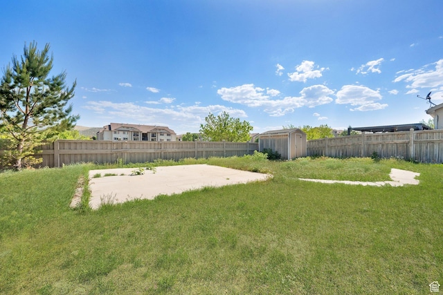 3482 E Kennekuk Cir, Eagle Mountain, UT 84005 - fenced backyard with a storage shed and a patio area