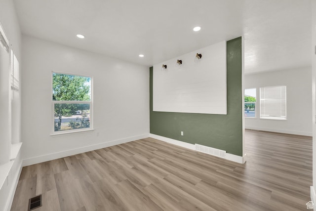 3482 E Kennekuk Cir, Eagle Mountain, UT 84005 - empty room with healthy amount of natural light, wood finished floors, and recessed lighting