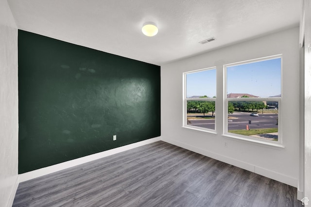 3482 E Kennekuk Cir, Eagle Mountain, UT 84005 - empty room with wood finished floors and baseboards