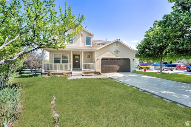 3482 E Kennekuk Cir, Eagle Mountain, UT 84005 - traditional home with a porch, driveway, a garage, and a front yard