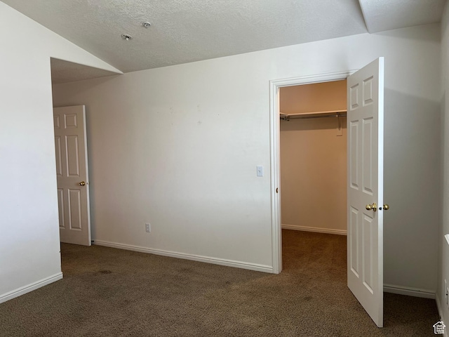 8228 N Cedar Rd Unit 11, Eagle Mountain, UT 84005 - unfurnished bedroom featuring carpet flooring, a spacious closet, and a closet