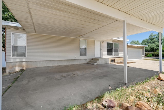 2234 W 300 N, West Point, UT 84015 - view of patio featuring a garage and an attached carport