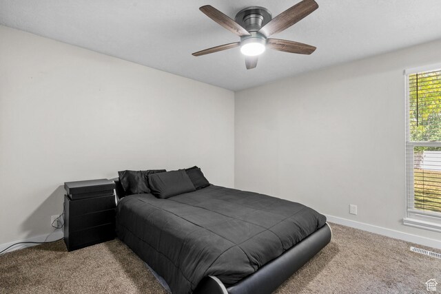 2234 W 300 N, West Point, UT 84015 - carpeted bedroom featuring baseboards and a ceiling fan