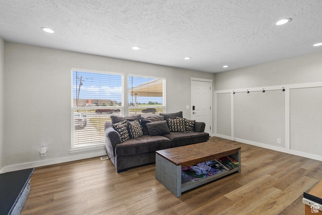 2234 W 300 N, West Point, UT 84015 - living area featuring a textured ceiling, recessed lighting, and wood finished floors