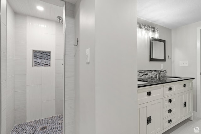 2234 W 300 N, West Point, UT 84015 - bathroom with double vanity, a tile shower, recessed lighting, backsplash, and tile patterned floors