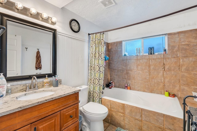 197 E Utah Ave, Payson, UT 84651 - bathroom featuring vanity, tiled shower / bath, tile patterned flooring, and a textured ceiling