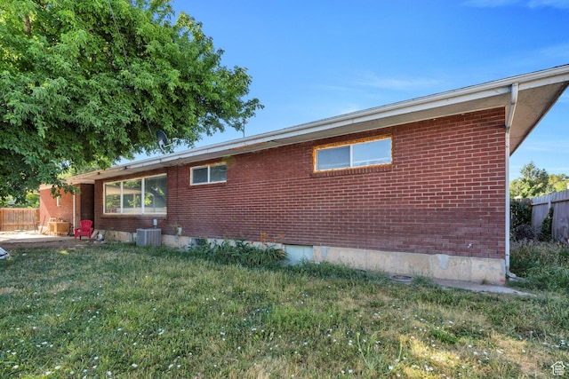 197 E Utah Ave, Payson, UT 84651 - view of property exterior with brick siding and a cooling unit