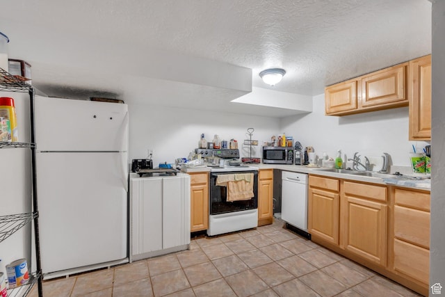 197 E Utah Ave, Payson, UT 84651 - kitchen featuring white appliances, light brown cabinets, washer / dryer, light countertops, and a textured ceiling