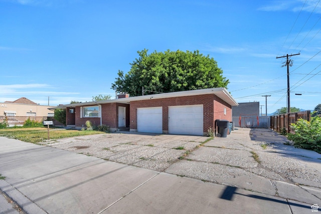 197 E Utah Ave, Payson, UT 84651 - ranch-style house with brick siding and an attached garage