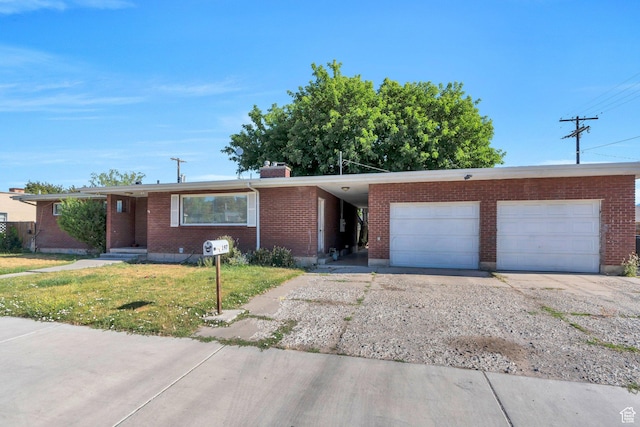 197 E Utah Ave, Payson, UT 84651 - ranch-style home with driveway, an attached garage, a chimney, and brick siding