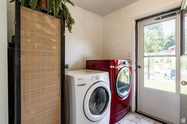 1795 S 50 W, Bountiful, UT 84010 - laundry room featuring washer and dryer, healthy amount of natural light, and light tile patterned floors