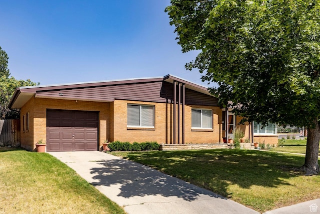 1795 S 50 W, Bountiful, UT 84010 - view of front of house with a front yard, driveway, an attached garage, and brick siding
