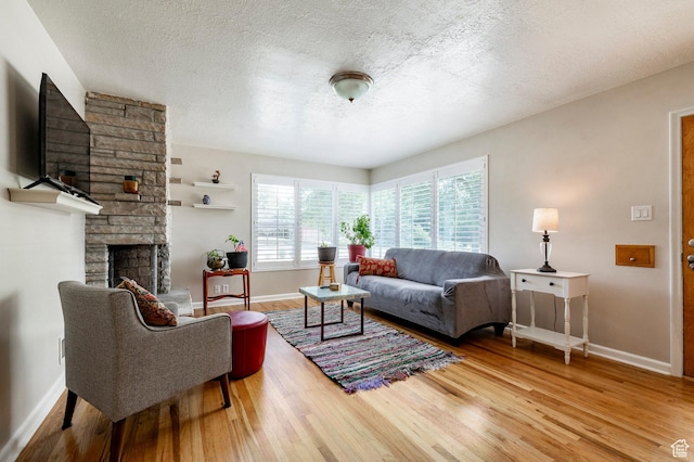 1795 S 50 W, Bountiful, UT 84010 - living room featuring wood finished floors, a fireplace, and a textured ceiling