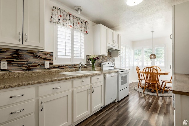 1795 S 50 W, Bountiful, UT 84010 - kitchen with white appliances, under cabinet range hood, tasteful backsplash, dark wood-type flooring, and white cabinets