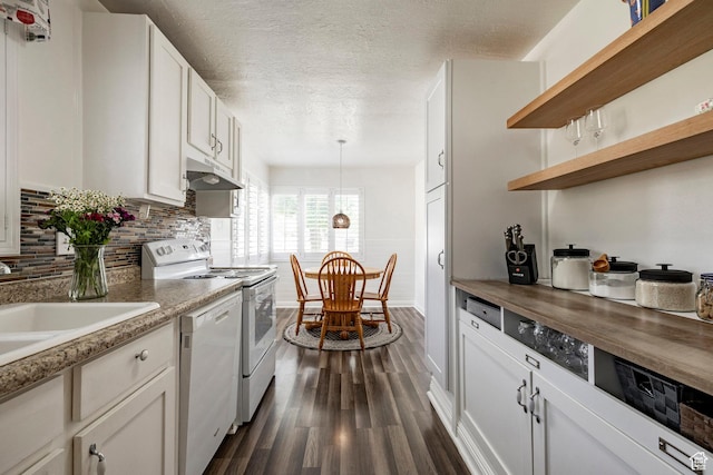 1795 S 50 W, Bountiful, UT 84010 - kitchen with white appliances, under cabinet range hood, dark wood finished floors, a textured ceiling, and backsplash