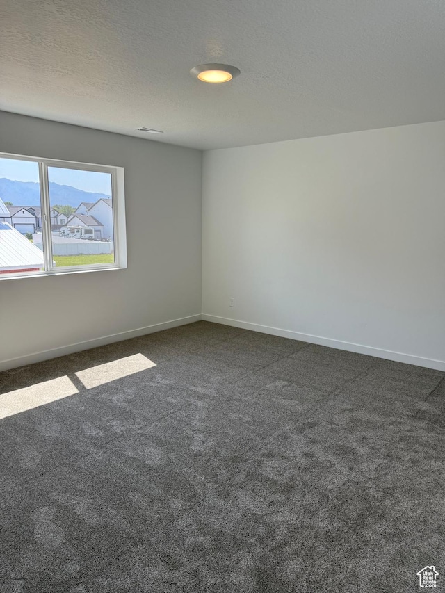 274 N 825 W, Clearfield, UT 84015 - spare room featuring dark colored carpet and baseboards