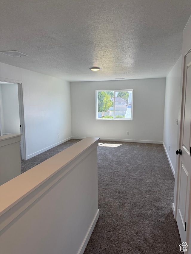 274 N 825 W, Clearfield, UT 84015 - carpeted spare room with baseboards and a textured ceiling
