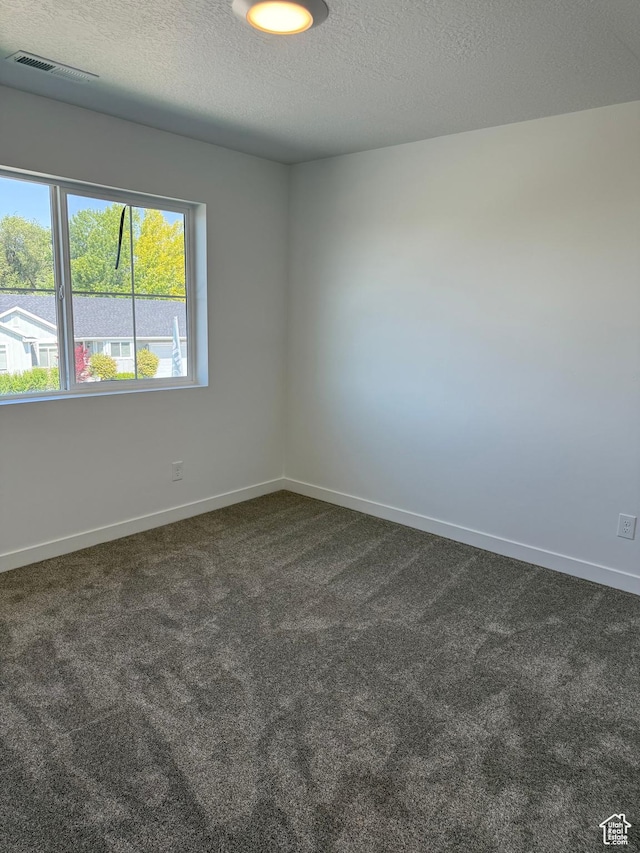 274 N 825 W, Clearfield, UT 84015 - empty room with dark carpet and a textured ceiling
