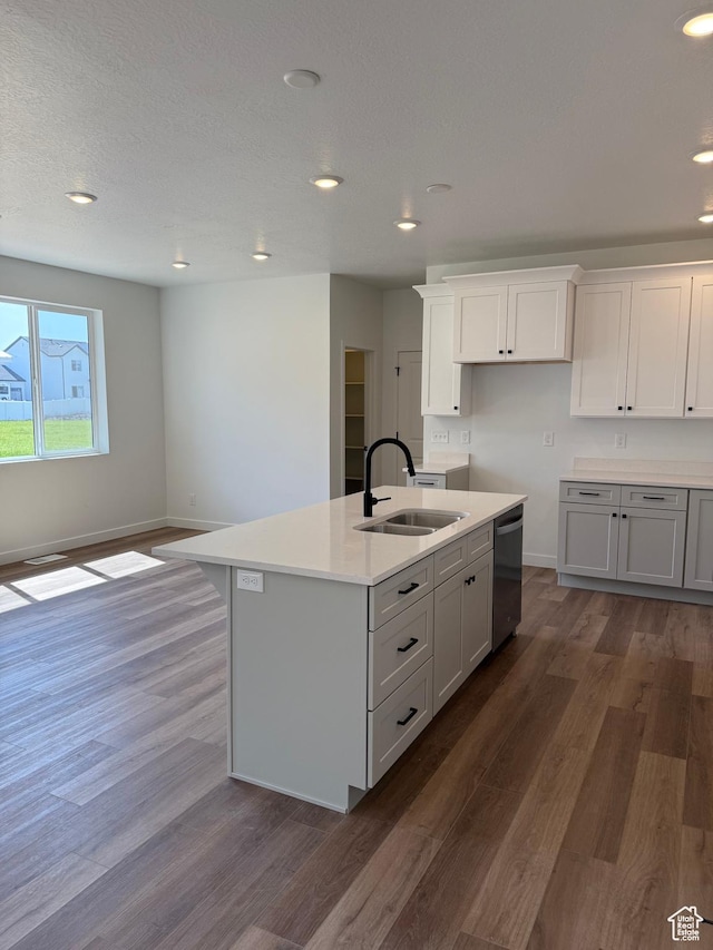 274 N 825 W, Clearfield, UT 84015 - kitchen featuring stainless steel dishwasher, dark wood-style floors, a center island with sink, recessed lighting, and light countertops