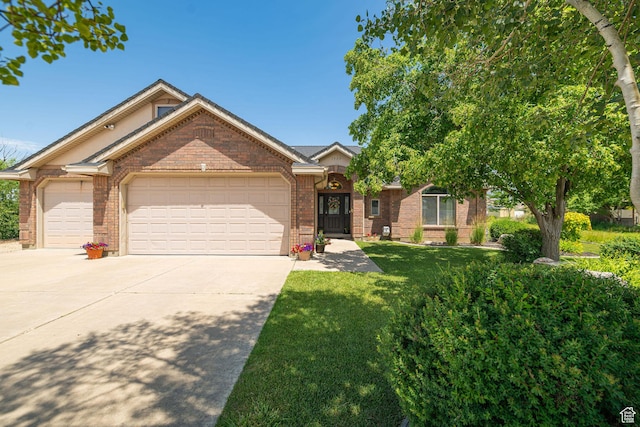 3520 W 2600 N, Plain City, UT 84404 - view of front of house with driveway, brick siding, an attached garage, and a front lawn