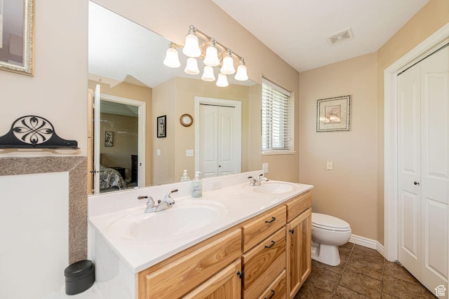 3520 W 2600 N, Plain City, UT 84404 - bathroom featuring a closet, ensuite bath, double vanity, and tile patterned flooring
