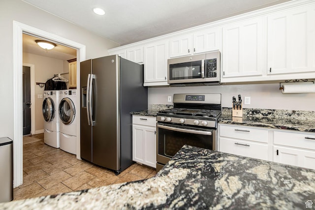 3520 W 2600 N, Plain City, UT 84404 - kitchen featuring stainless steel appliances, separate washer and dryer, white cabinets, dark stone countertops, and recessed lighting