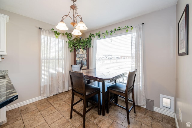 3520 W 2600 N, Plain City, UT 84404 - dining space featuring a chandelier and stone tile floors