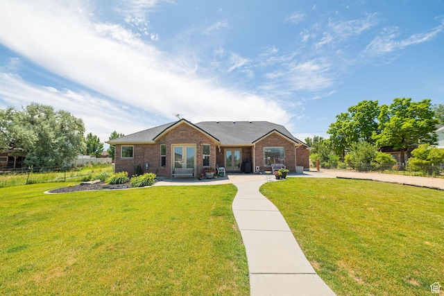 3520 W 2600 N, Plain City, UT 84404 - view of front of property featuring french doors, brick siding, a shingled roof, and a patio area