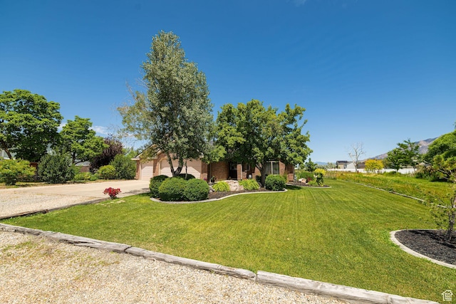 3520 W 2600 N, Plain City, UT 84404 - view of front of property with driveway, a front yard, and a garage